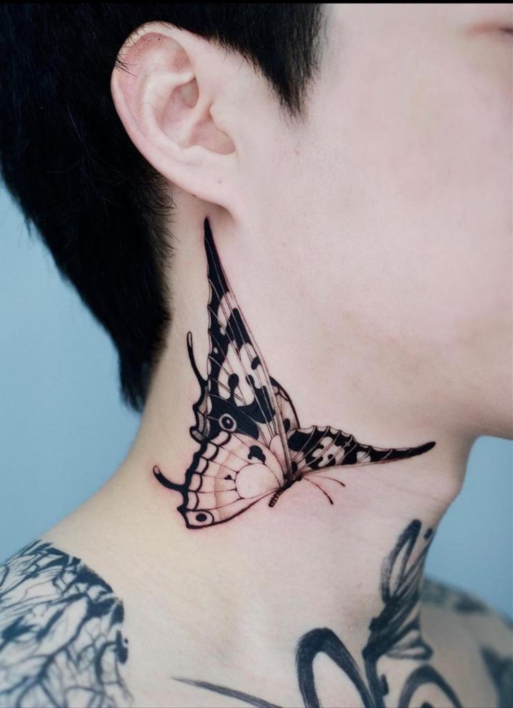 Butterfly tattoos on ear and neck 1