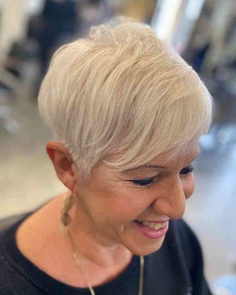 chic pixie with wispy side bangs for 60 year old ladies